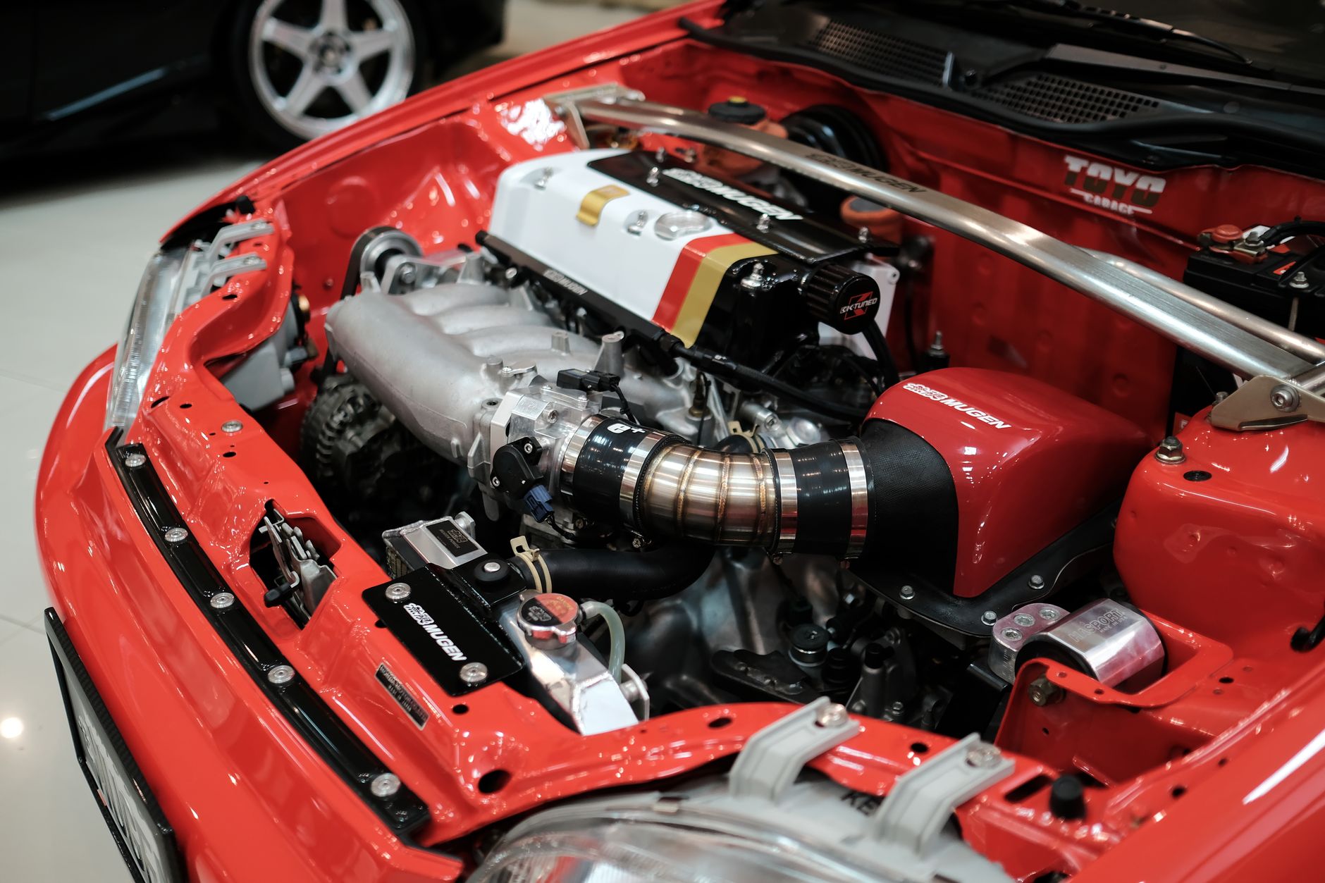 Modified turbocharged engine bay representing modifications requiring declaration to UK insurer