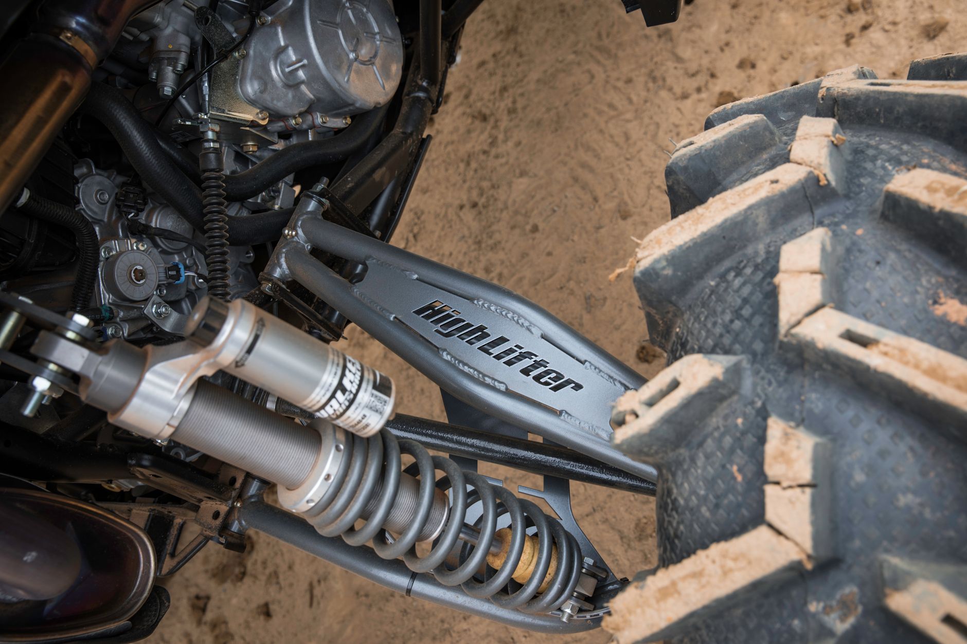 Stiff aftermarket coilover suspension fitted to a stripped-out track weapon build